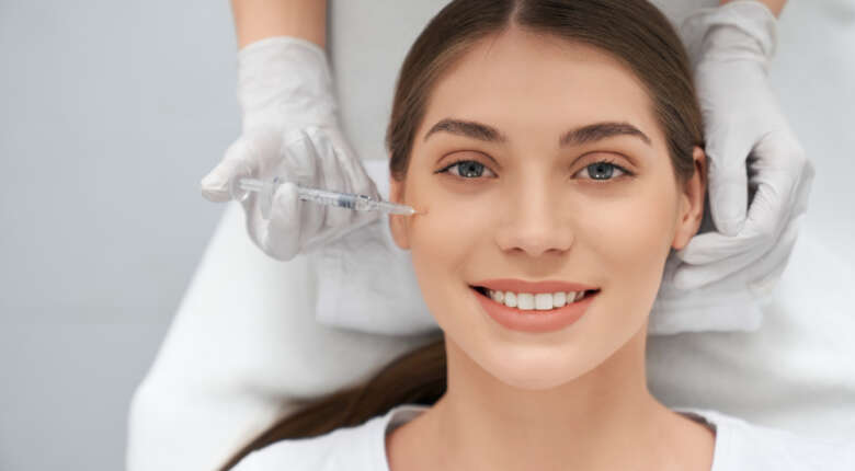 Close-up of a woman receiving a facial injection.